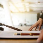 Gavel and legal documents on a desk representing workplace harassment claims in the UAE