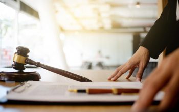Gavel and legal documents on a desk representing workplace harassment claims in the UAE