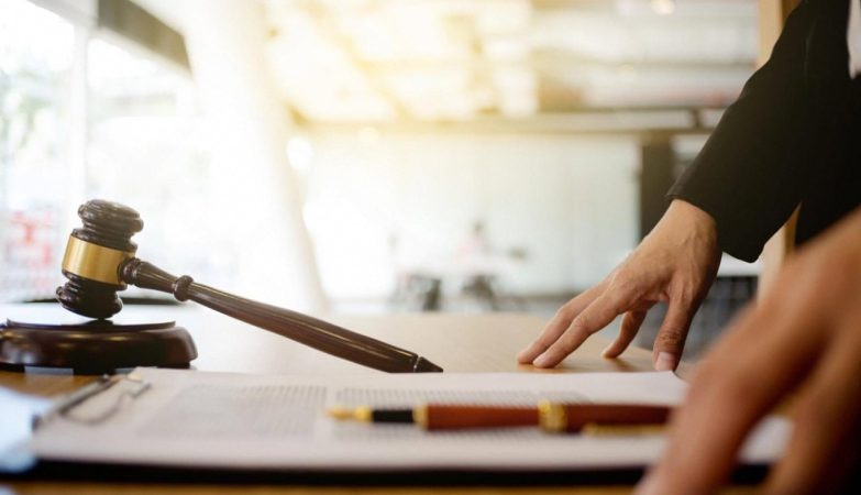 Gavel and legal documents on a desk representing workplace harassment claims in the UAE